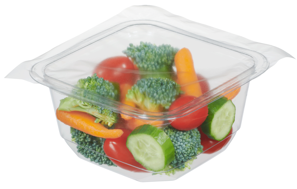 Sealed, single-compartment tray with broccoli, carrots, tomatoes and cucumbers.